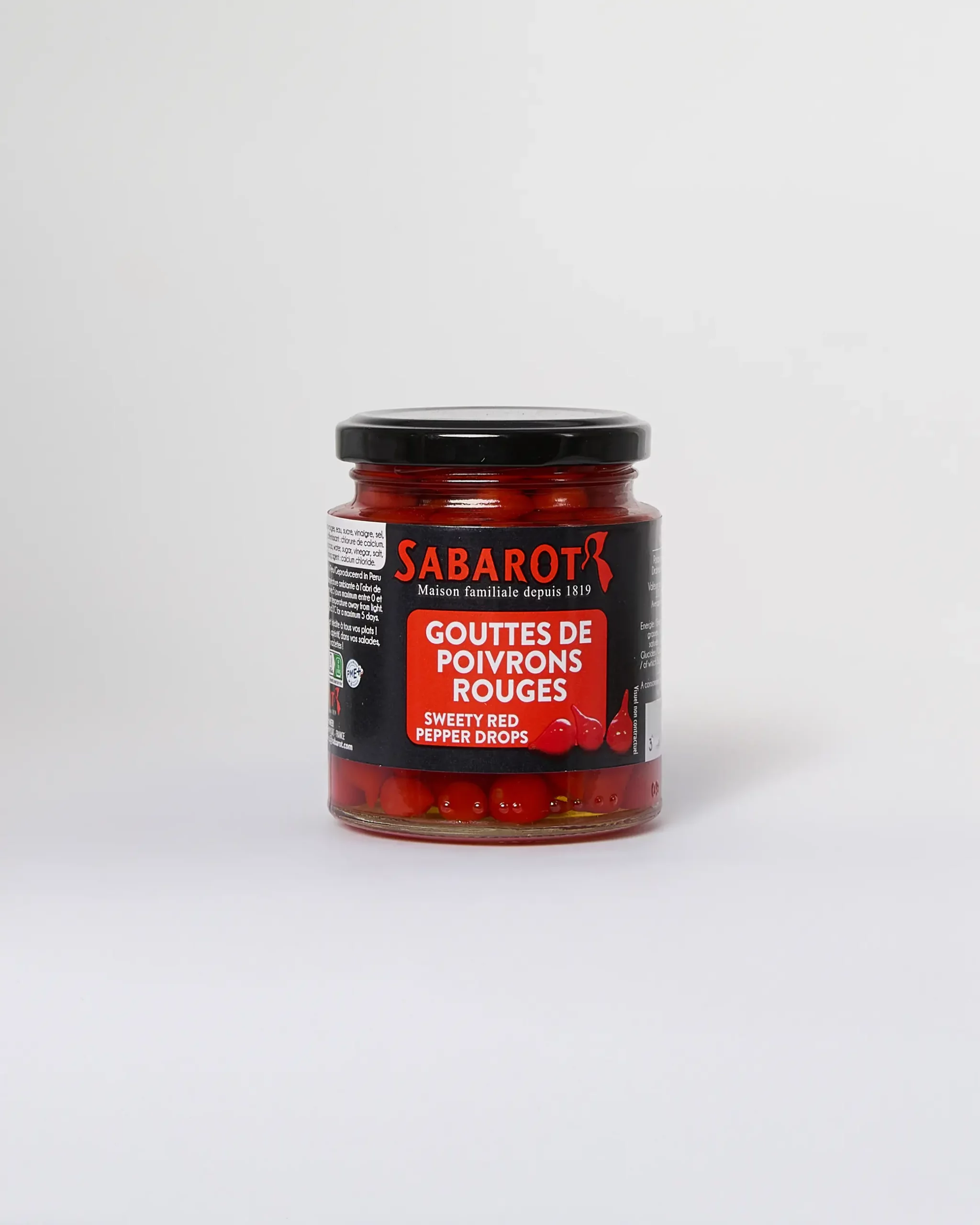 Gouttes de poivrons rouges de la maison Sabarot, condiment raffiné idéal pour tapas et recettes basques, proposé par La Kantxa